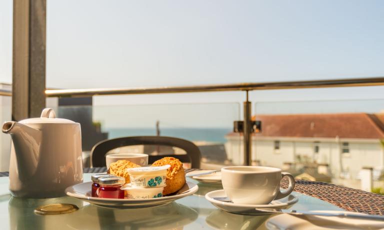 Breakfast on a balcony with sea views