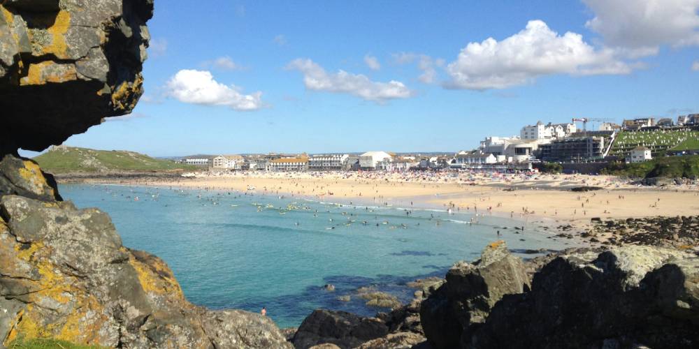 Porthmeor Beach with golden sands and turquoise waters in St Ives
