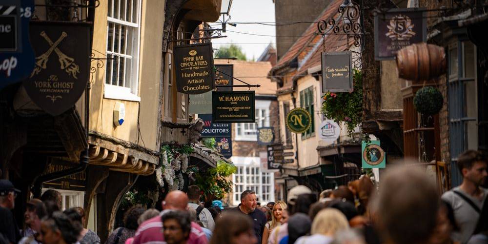 Crowds exploring the historic York Shambles shopping street
