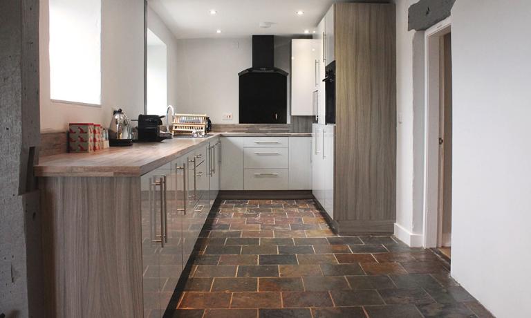 Spacious fully-fitted kitchen with coffee maker