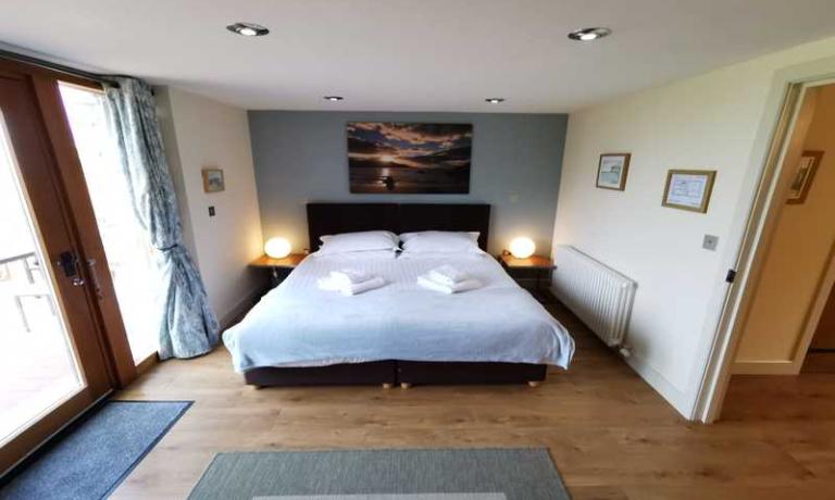 Bedroom with patio door onto terrace
