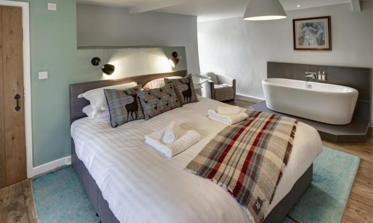 Sumptuous king-size bed in double bedroom